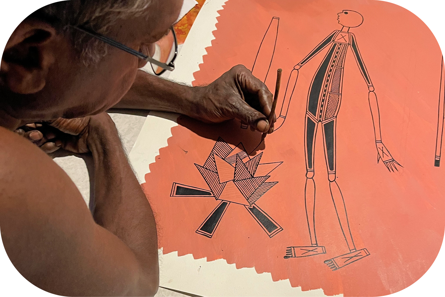 Artist Neville Namarnyilk painting fire.