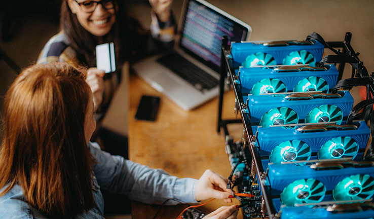 Two women working on a computer