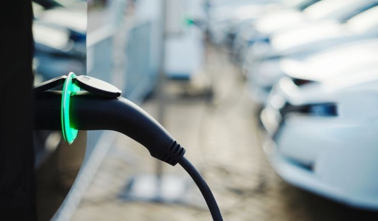 Image of electric vehicles at a fast charging station.