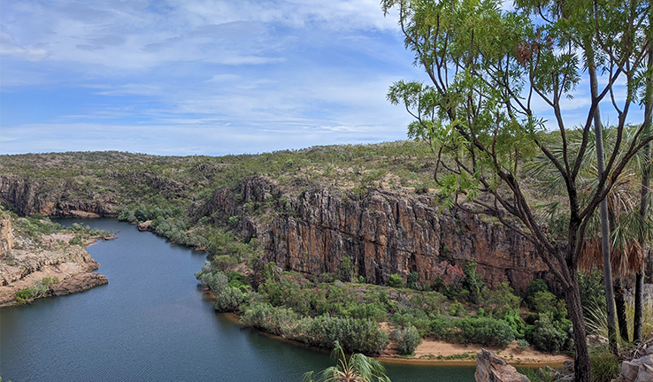 Photo of Australian bushland with river, gorge and blue sky.