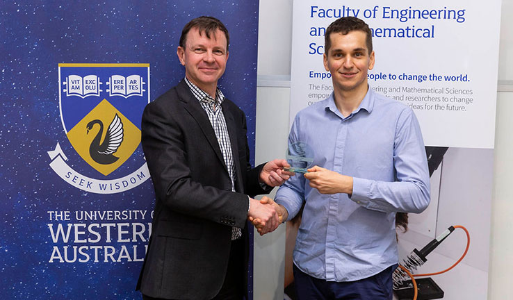 PPhoto of last year’s prize winner accepting the award from the Chief Metrologist.