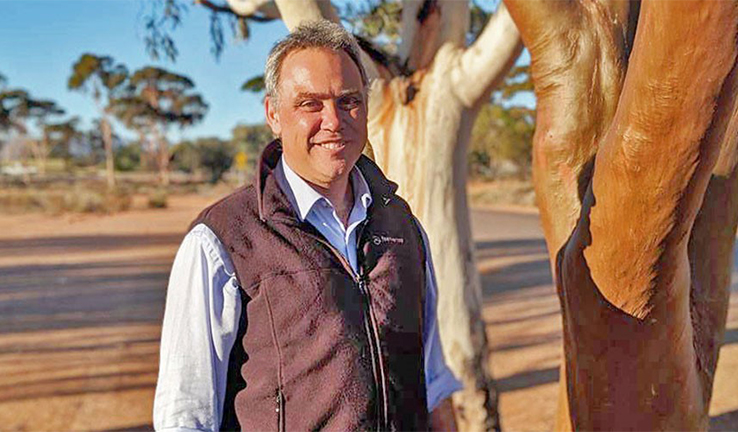 Shane Holland stands next to a gum tree near Spear Creek Shane Holland stands next to a gum tree near Spear Creek