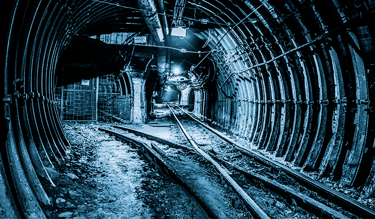 Photo of a railway in a mining tunnel Photo of a railway in a mining tunnel