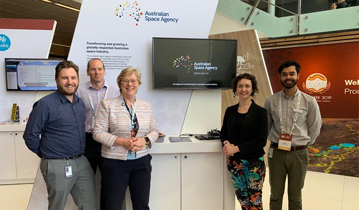 Photo of Australian Space Agency officials at their exhibition stand. Photo of Australian Space Agency officials at their exhibition stand.