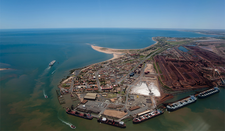 Ariel photo of Port Headland on a clear day showing wharves and infrastructure. Ariel photo of Port Headland on a clear day showing wharves and infrastructure.