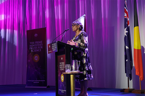 Photo of Aunty Violet on stage at the awards.