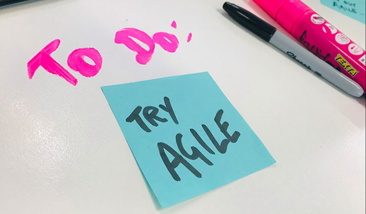 Photo of a post-it note with ‘Try Agile’ written on it and ‘To do’ written above.