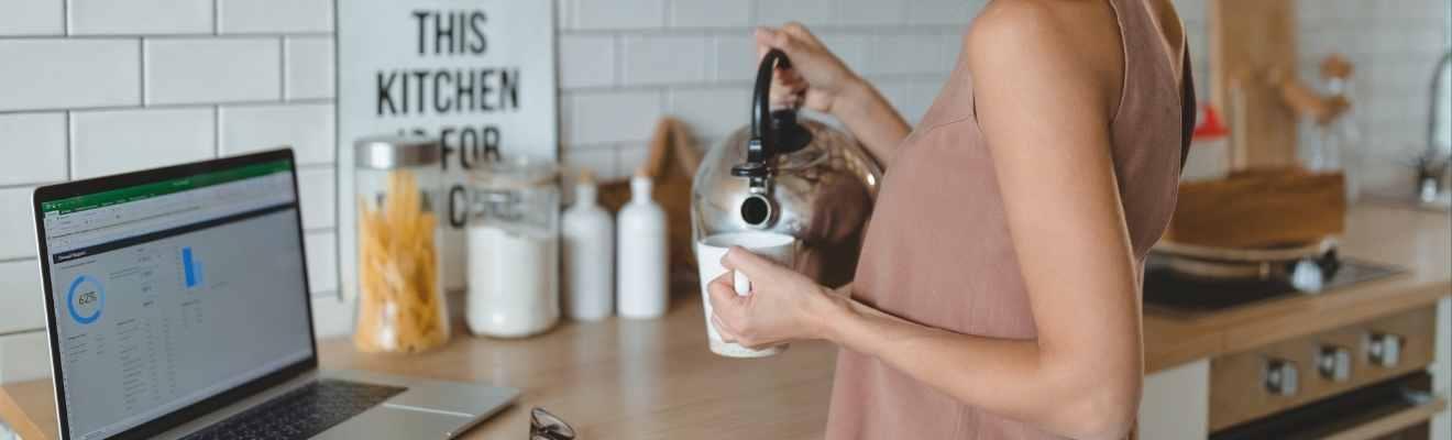 A person making tea in the kitchen.