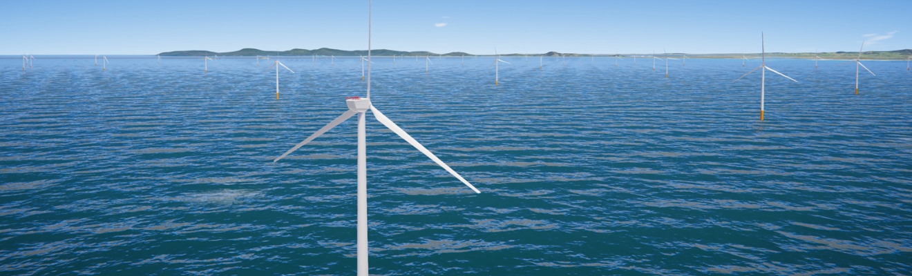 White wind turbines in water with mountains behind