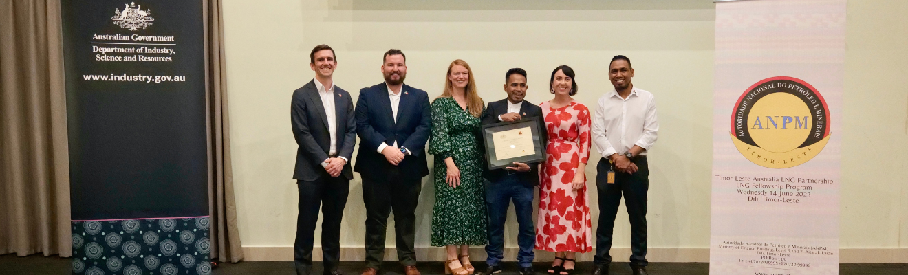 LNG Fellowship participant Abel da Costa receiving his certification of completion with mentor Orla McSharry (OHS specialist at NOPSEMA), DISR Timor Sea staff Dan Glover, Nick Kettle and Lucy West, and Digorio Pereira (ANPM).