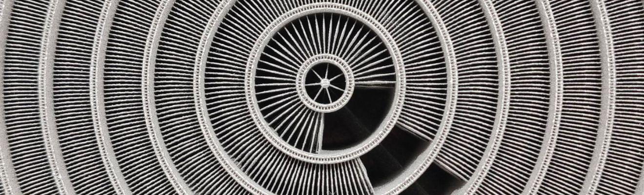 Close up photo of the concentric circles of Conflux’s 3D printed heat exchanger.