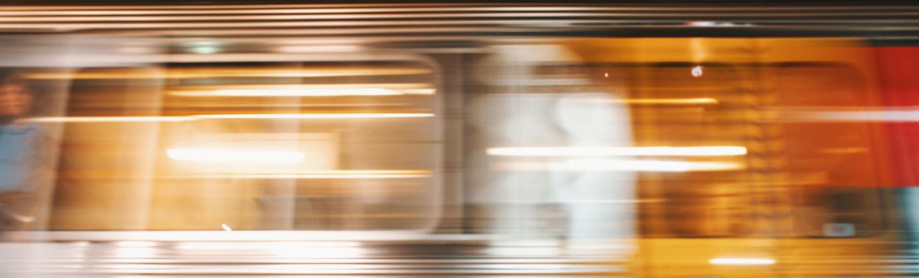A train in motion at a station