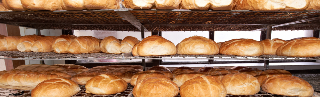 Bread products on wire racks in a bakery