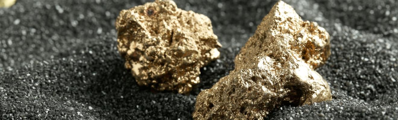 REQ 2024 Q4 image featuring a gold nugget in sand.