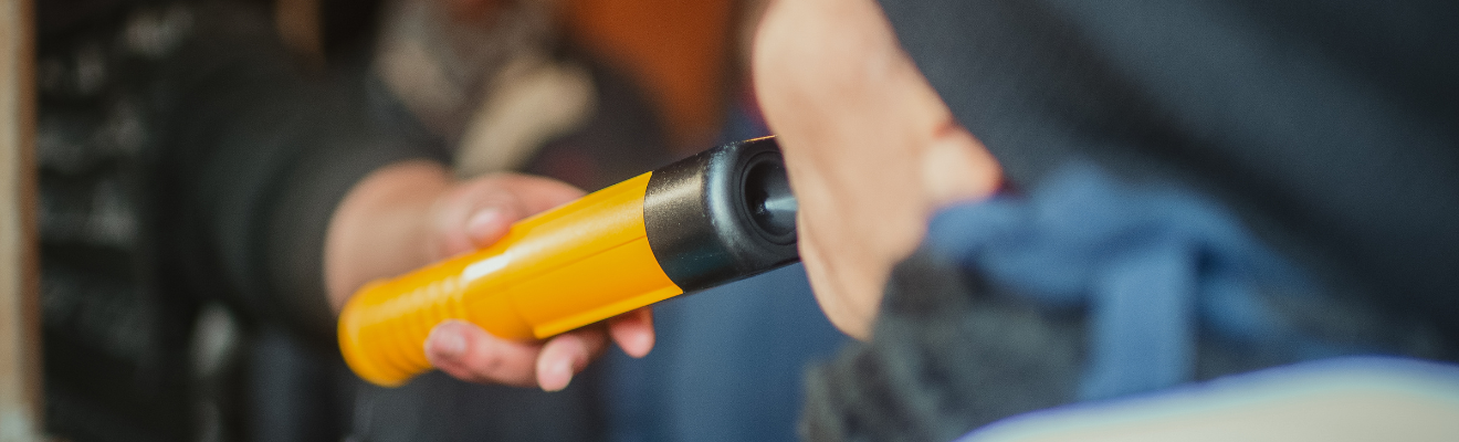 Close up image of an evidential breath analyser being used