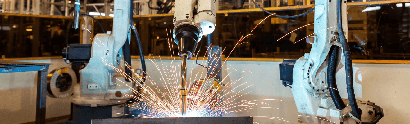 Industrial robots welding in a factory