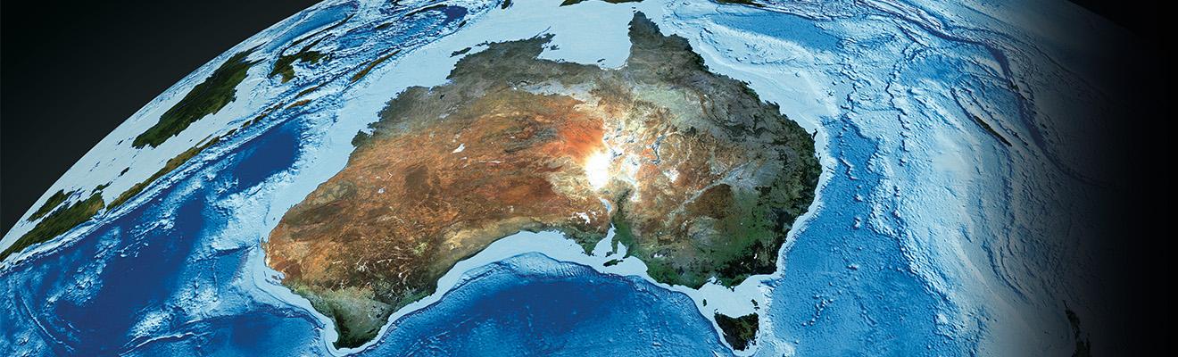 Satellite photo of Australia with swirling ocean.
