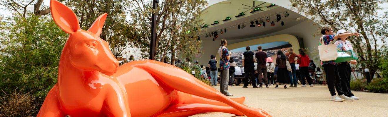 An orange statue of a kangaroo lying down outside the Australia Pavilion at the World Expo Osaka 2025.