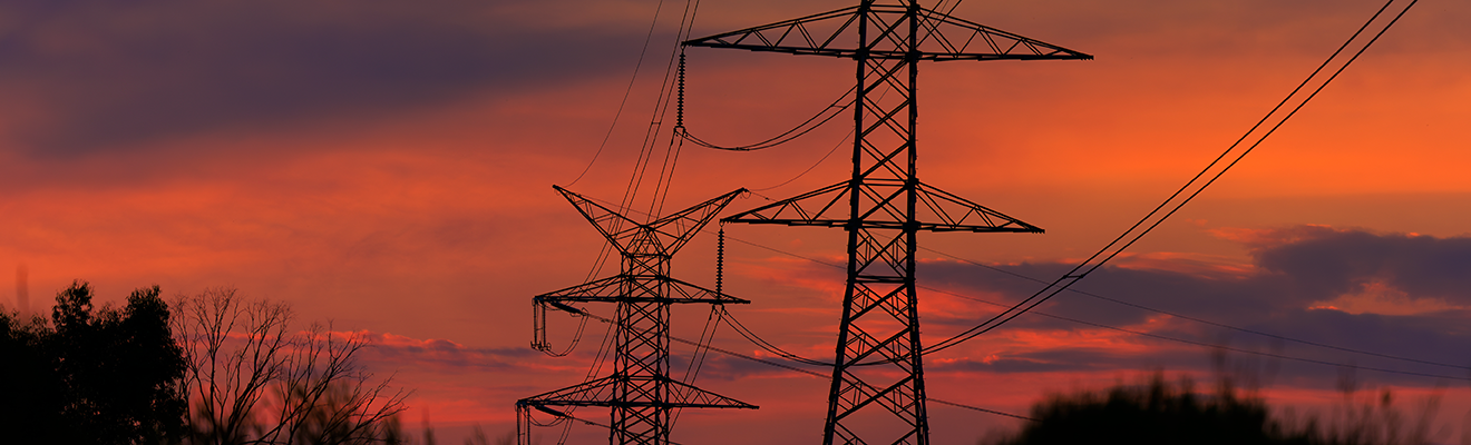 Powerlines in a sunset sky