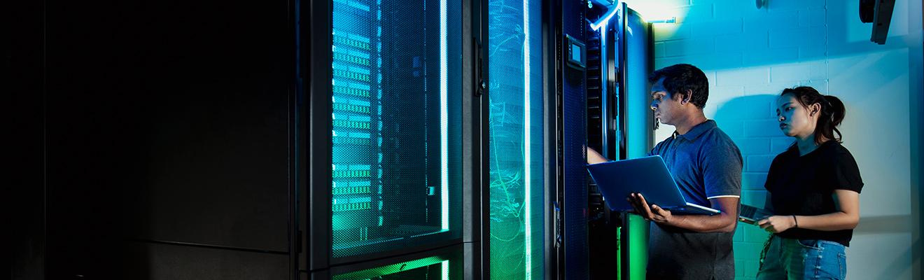 Technicians working in a server room