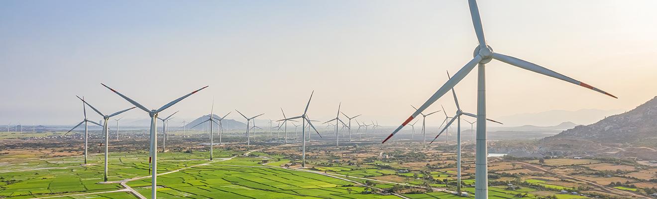 Wind turbines generating electricity on rice field at Phan Rang, Ninh Thuan, Vietnam. 