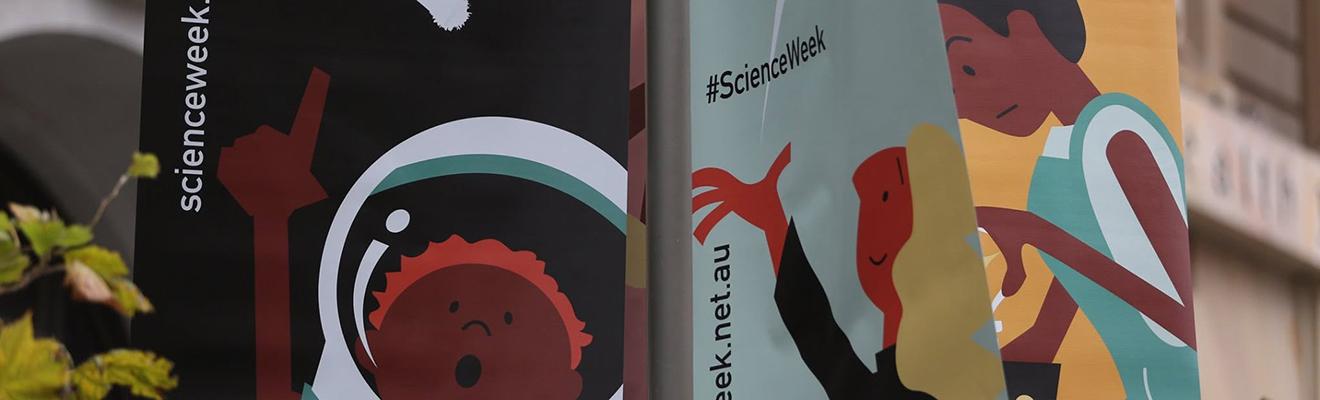 Three National Science Week Questacon flags showing 3 of their science activities cartoon characters.