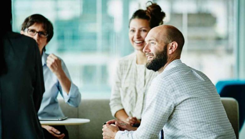 People sitting around a table, talking