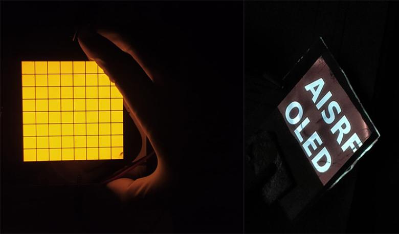 Yellow light with grid lines and sign 'AISRF OLED'