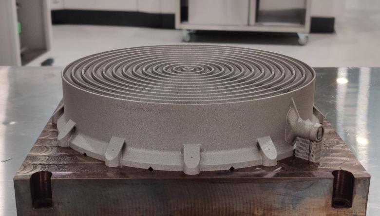 Side view of the 3D printed heat exchanger, placed on a table.
