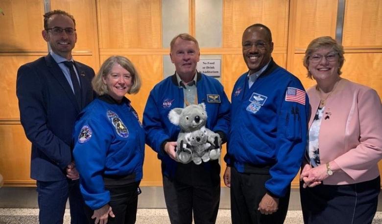 The space koalas are on display in the Australian Space Agency foyer, on loan from the Space Industry Association of Australia. The Australian Space Agency team holding the stuffed toy koala and joey in the Australian Space Agency foyer.
