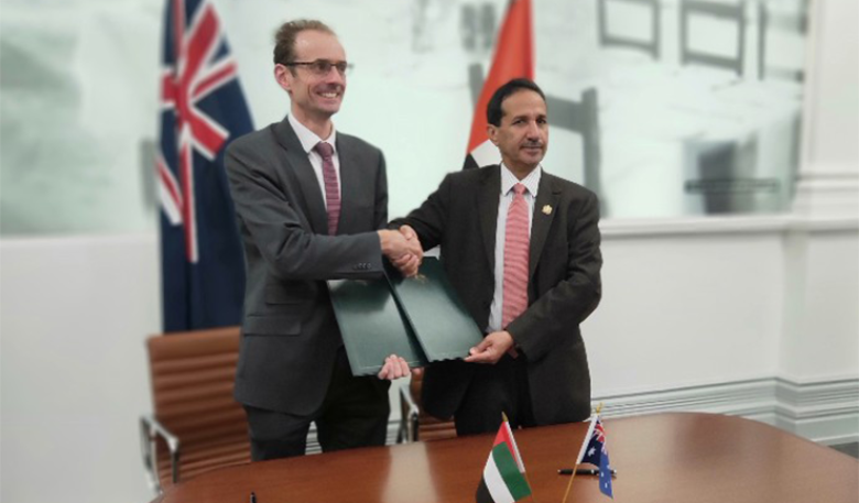 Photo of representatives of the Australian and UAE Space Agencies shaking hands in a boardroom after signing an MoU. Photo of representatives of the Australian and UAE Space Agencies shaking hands in a boardroom after signing an MoU.