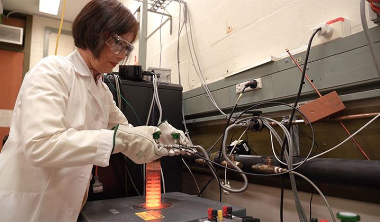 A measurement scientist working in a laboratory.