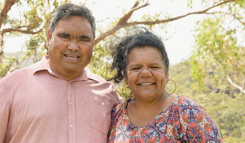 Photo of two Indigenous business owners in a bush setting.