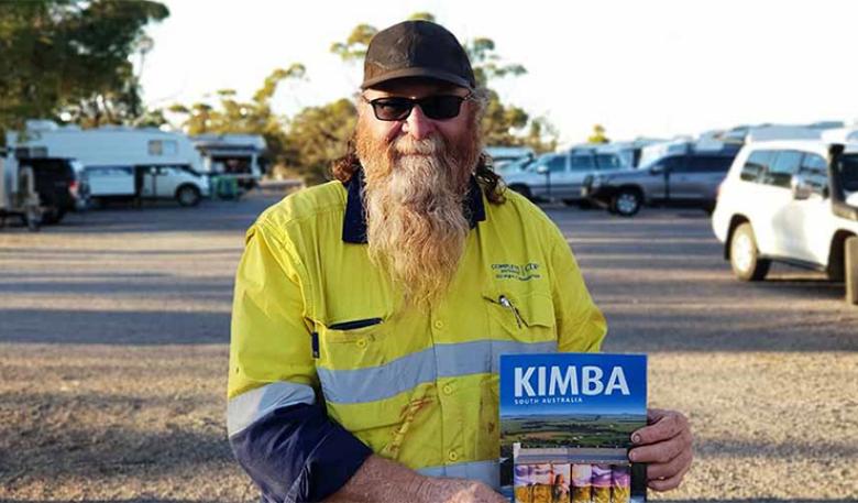Red O’Donohue holds a copy of the Kimba Brochure in front of the Recreational Reserve