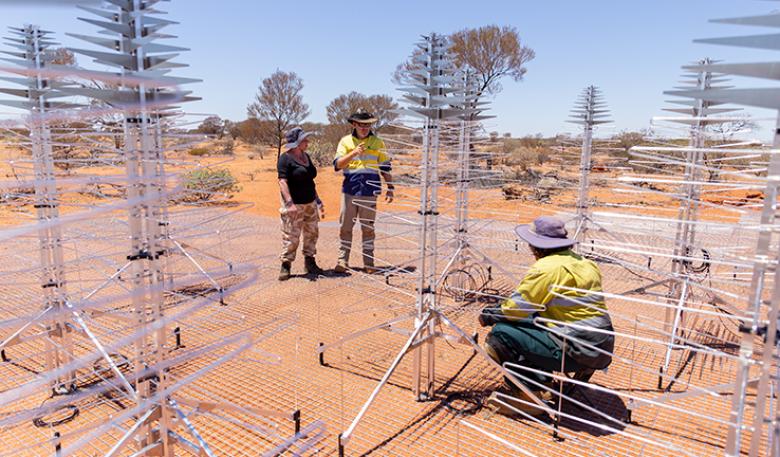 Photo of technicians working on the SKA in the desert.