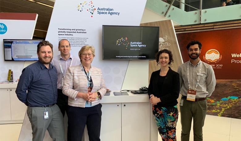 Photo of Australian Space Agency officials at their exhibition stand. Photo of Australian Space Agency officials at their exhibition stand.
