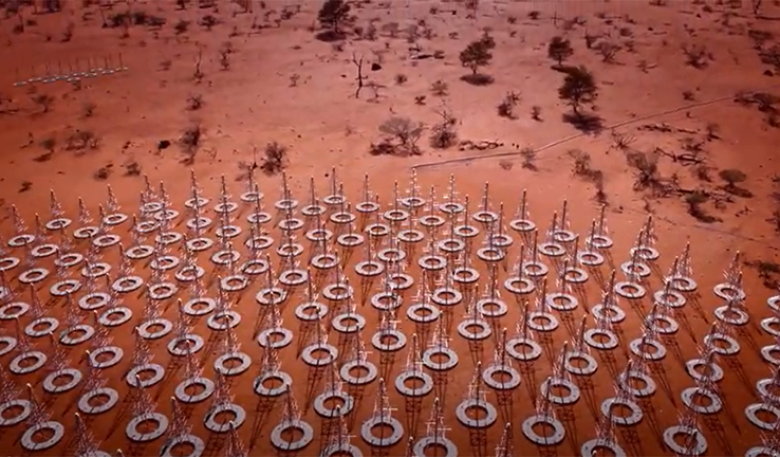 Ariel photo of the SKA in outback Autralia, showing a series of large discs with antenna