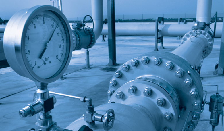 Photograph of valve and pipes at a large gas project