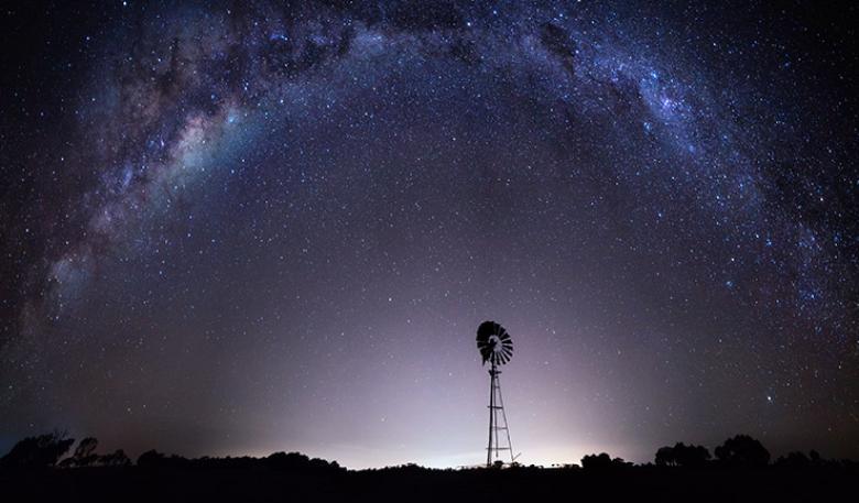 Purple night sky with stars showing the Milky Way from outback Australia. Purple night sky with stars showing the Milky Way from outback Australia.