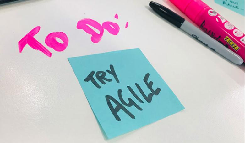 Photo of a post-it note with ‘Try Agile’ written on it and ‘To do’ written above.