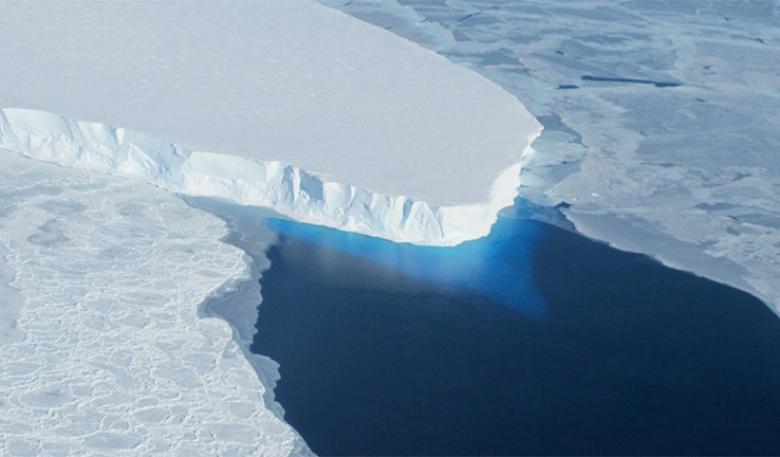 A protruding piece of glacier – the ‘tongue’ – floats in blue, icy water.