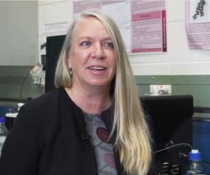 Screenshot of Dr Åsa Jämting in her office talking about measurement science. She’s smiling warmly and engaged in the conversation
