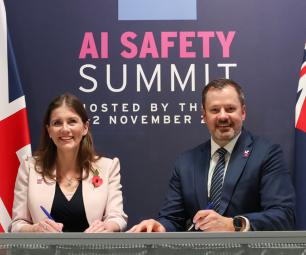 Minister for Industry and Science signing the statement with the UK Secretary of State for Science, Innovation and Technology