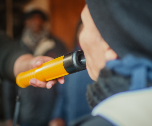 Close up image of an evidential breath analyser being used 