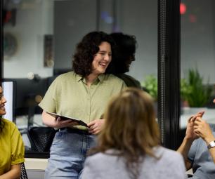 A group of young business people discussing their plans in an informal office
