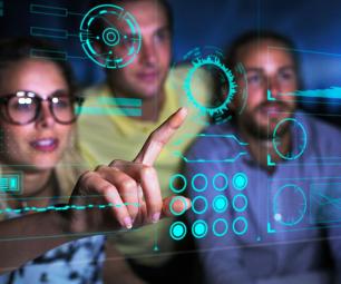 People looking at pointing to data on a screen