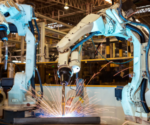 Industrial robots welding in a factory