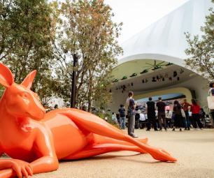 An orange statue of a kangaroo lying down outside the Australia Pavilion at the World Expo Osaka 2025.