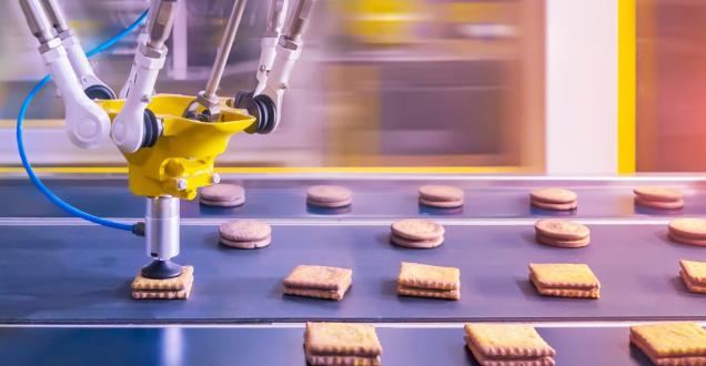 A robot making biscuits in a factory