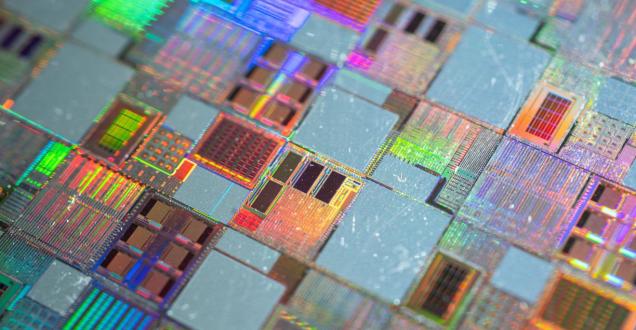 Close up image of semiconductor silicon wafer with text ‘Grant opportunity - International Partnerships in Critical Minerals Program – applications now open’. 